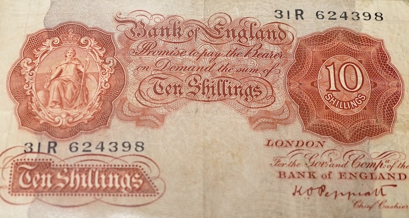 A collection of UK George V to Queen Elizabeth II banknotes, in an album